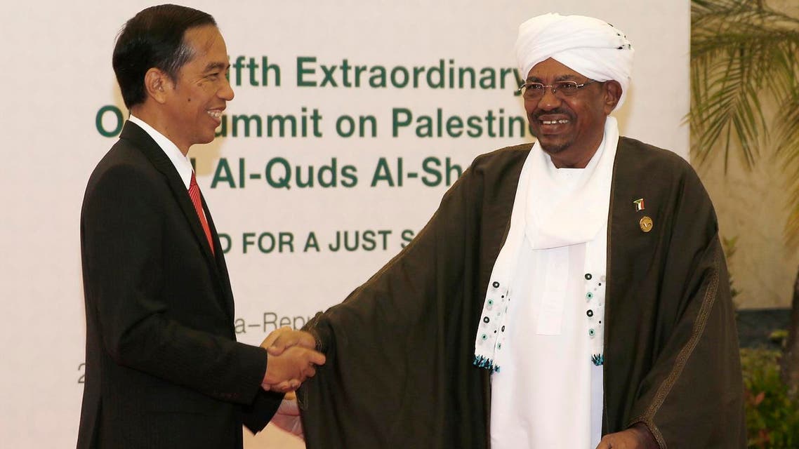 Indonesian President Joko "Jokowi" Widodo, left, greets his Sudanese counterpart Omar al-Bashir upon his arrival for the extraordinary Organization of Islamic Cooperation (OIC) summit on Palestinian issues in Jakarta, Indonesia, Monday, March 7, 2016. Al-Bashir is wanted by the International Criminal Court on war crimes allegations linked to the conflict in Sudan's Darfur region. (Darren Whiteside/Pool Photo via AP)