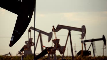 In this April 24, 2015 photo, pumpjacks work in a field near Lovington, N.M. Oil supply from the United States, Russia and other countries outside of OPEC is expected to drop sharply next year. (AP)