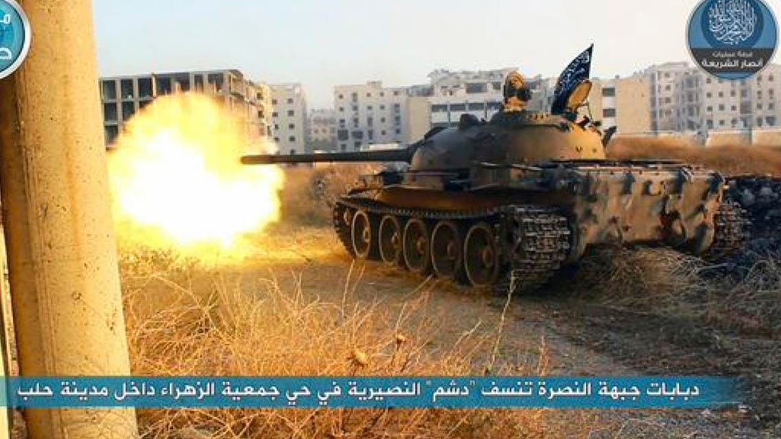 In this image posted on the Twitter page of Syria’s al-Qaida-linked Nusra Front on early Tuesday, July 7, 2015, a tank from the Nusra Front fires during their clashes against the Syrian government forces at the western Zahra neighborhood in Aleppo city, Syria. (File photo: AP)