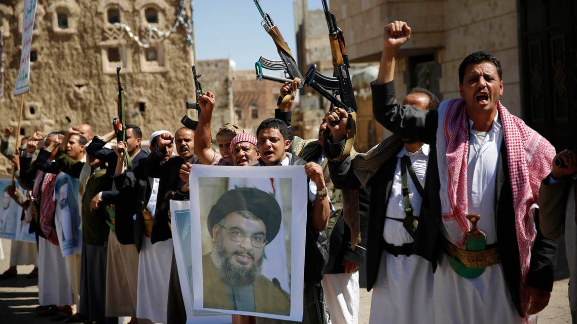 In this Thursday, March 3, 2016 photo, Shiite rebels, known as Houthis, hold a poster of Hezbollah leader Sheikh Hassan Nasrallah during a gathering to show their support to Hezbollah in Sanaa, Yemen. (AP)