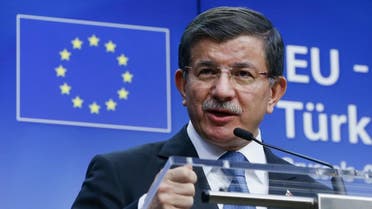Turkish Prime Minister Ahmet Davutoglu speaks at a news conference at the end of a EU-Turkey summit in Brussels March 8, 2016 (Reuters)