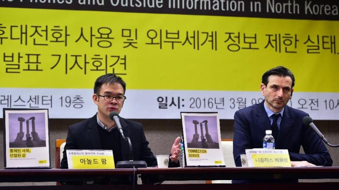 Amnesty East Asia researcher Arnold Fang (L) speaks as Amnesty East Asia regional director Nicholas Bequelin during a press conference on restrictions on mobile phones and outside information in North Korea, in Seoul. (AFP)