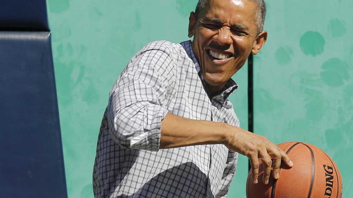 U.S. President Barack Obama reacts to getting hit on the head by a rebound while playing basketball, an exercise activity during the annual Easter Egg Roll at the White House in Washington April 6, 2015. (Reuters)