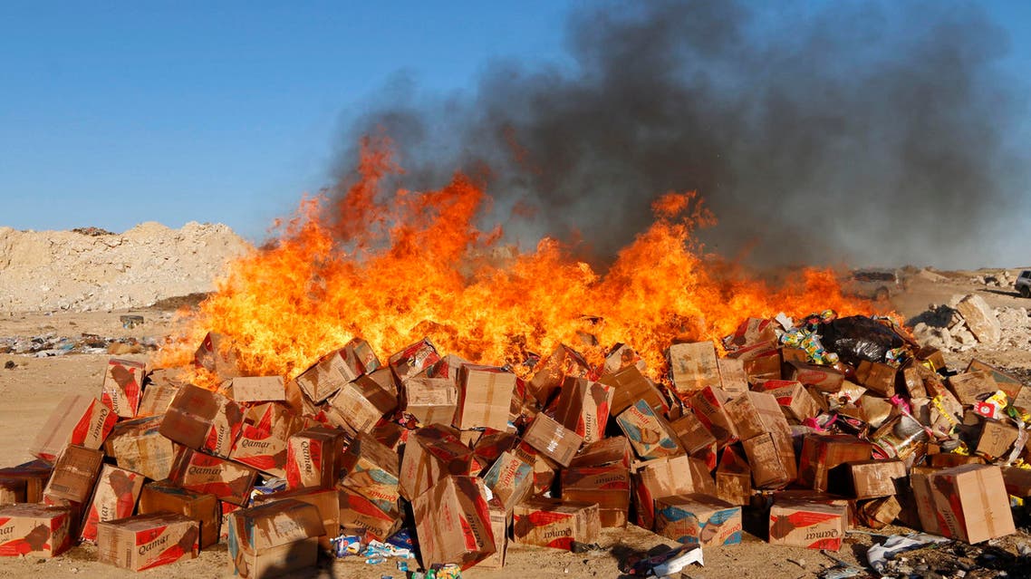 Goods confiscated by men, who say they were hired by the Islamic State to monitor the quality of goods in markets, are set on fire in central Raqqa November 4, 2014. (Reuters)