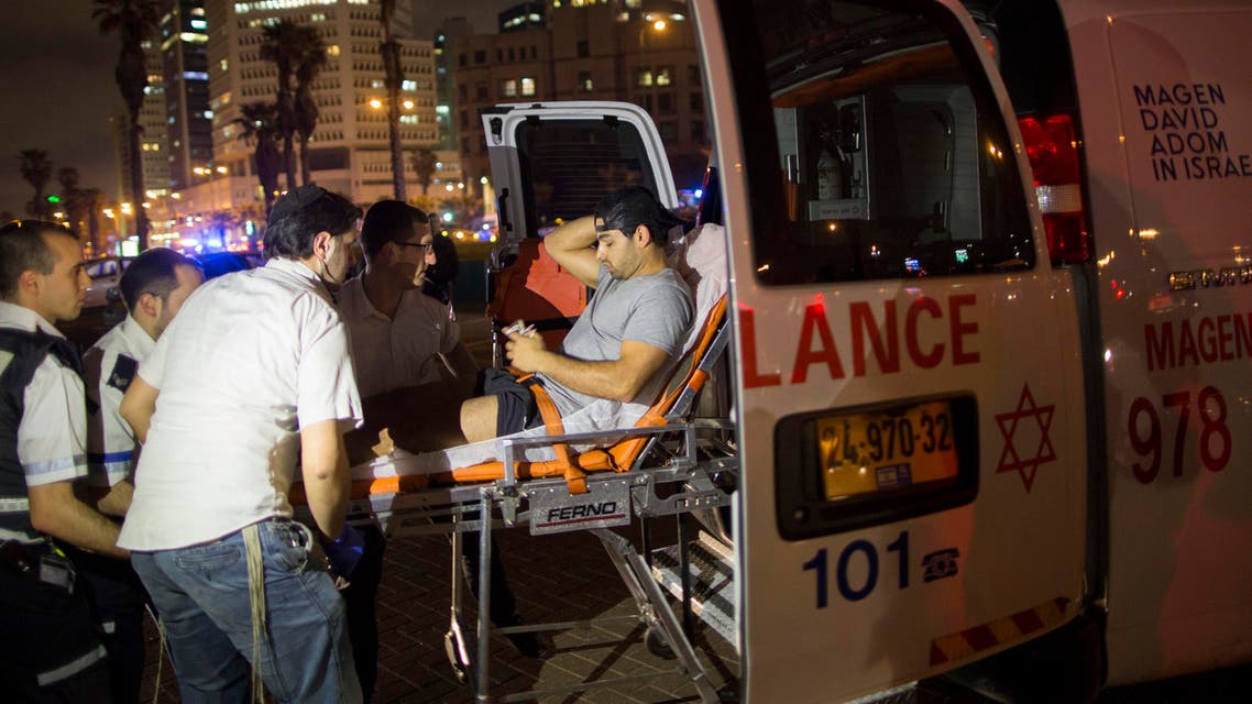 A wounded man is evacuated from the scene of a stabbing attack in Jaffa, a mixed Jewish-Arab part of Tel Aviv, Israel, on Tuesday, March 8, 2016. (AP)