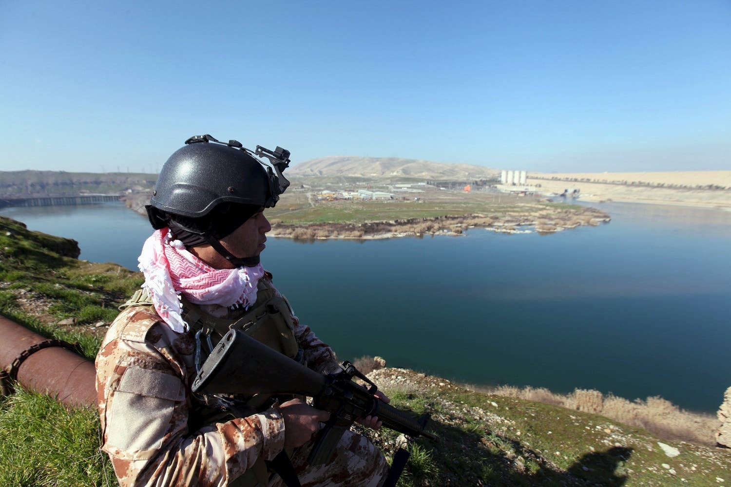An Iraqi Kurdish Peshmerga stands guard near the Mosul Dam in northern Iraq, February 3, 2016. (Reuters)