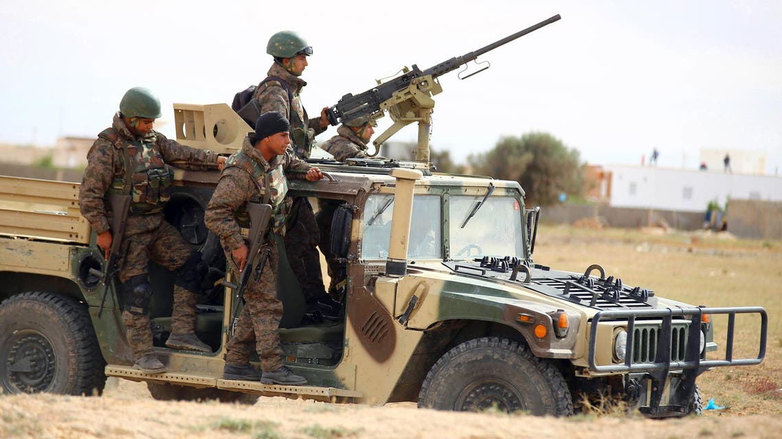 Tunisian soldiers patrol as they search for attackers still at large in the outskirts of Ben Guerdane, southern Tunisia, March 8, 2016. (AP)