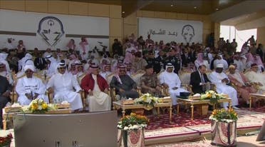 Saudi King Salman and Bahrain King Hamad discuss during the ceremony. (Al Arabiya)