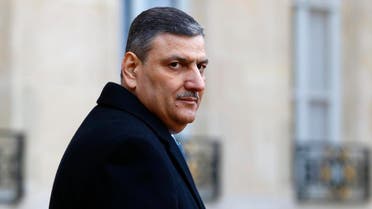 Former Syrian Prime Minister Riad Hijab, now coordinator of the Syrian opposition team walks to his car after his meeting with French President Francois Hollande at the Elysee Palace in Paris, Monday, Jan. 11, 2016. (AP Photo/Francois Mori)