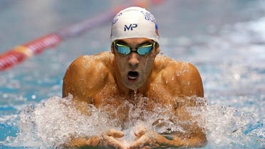 n this Dec. 3, 2015, file photo, Michael Phelps swims the breaststroke leg of the men's 200-meter individual medley in a preliminary race at the U.S. Winter Nationals swimming event in Federal Way, Wash. Phelps moved to suburban Phoenix a few months ago after Bob Bowman, basically the only coach he’s ever had, took a job running Arizona State’s promising but underachieving swim program. (AP)