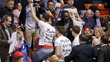 Protesters are escorted out of UIC Pavilion before Republican U.S. presidential candidate Donald Trump's rally at the University of Illinois at Chicago. (Reuters)