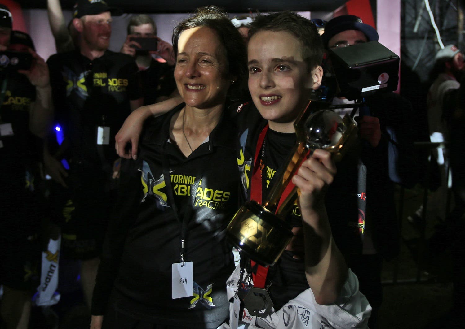 Luke Bannister of Somerset holds the trophy next to his mother (Photo: AP)