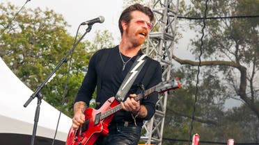  FILE - In this Sept. 11, 2015 file photo, Jesse Hughes of Eagles of Death Metal performs at Riot Fest & Carnival in Douglas Park in Chicago. Hughes, frontman of the U.S. band whose Nov. 13 performance at the Bataclan theater in Paris was stormed by Islamic extremist suicide bombers, says he feels a "sacred" responsibility to finish the show and is happy to be back in Paris despite raw nerves. The Eagles of Death Metal band is scheduled to play at the Olympia Theatre in Paris on Tuesday, Feb. 16, 2016 - just a little over three months to the day since the Paris attacks that killed 89 people. (Photo by Barry Brecheisen/Invision/AP, File)