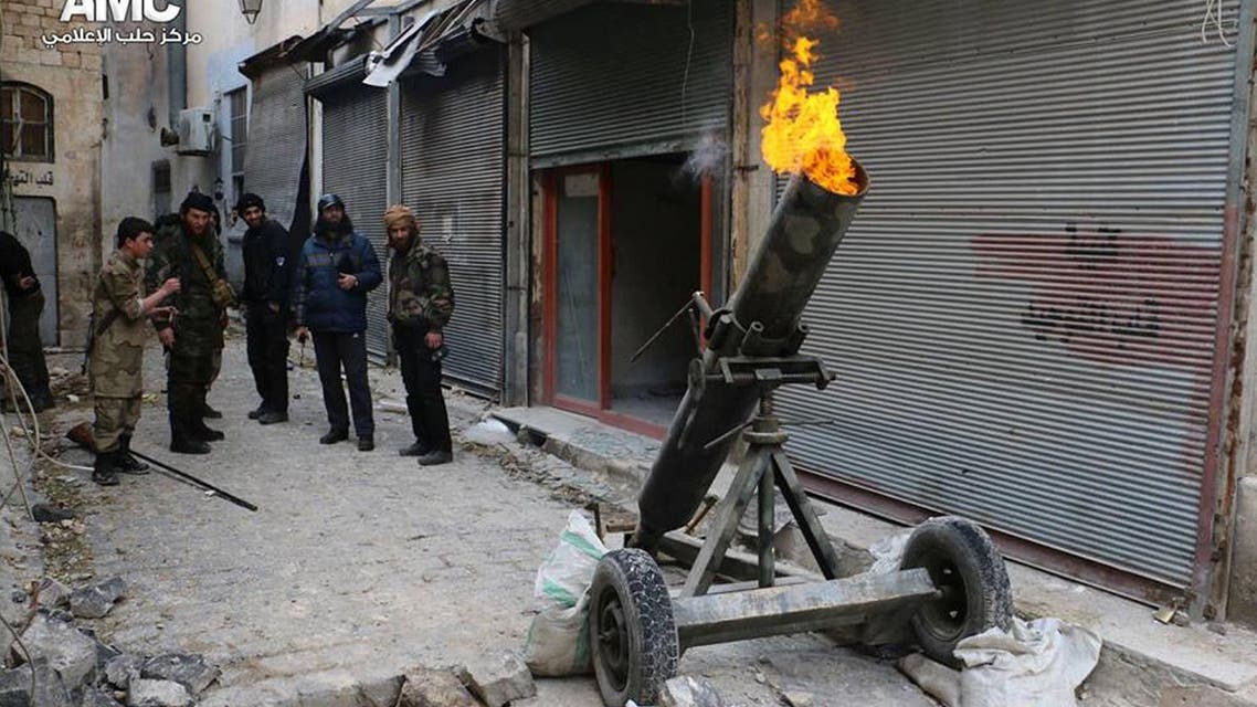This file photo provided on Sunday Feb. 15, 2015 by the Syrian anti-government activist group Aleppo Media Center (AMC), which has been authenticated based on its contents and other AP reporting, shows Syrian rebels firing locally made shells against the Syrian government forces, in Aleppo, Syria. (AP Photo/Aleppo Media Center, AMC, File)