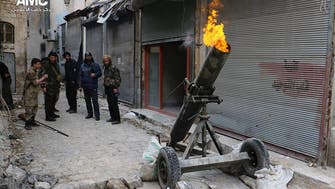 Militants fire shells from Syria buffer despite heavy arms pullout 