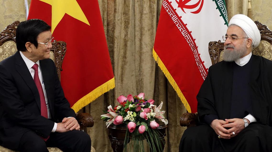 President Hassan Rowhani, right, meets with Vietnam's President Truong Tan Sang at the Saadabad Palace in Tehran, Iran, Monday, March 14, 2016. (AP)