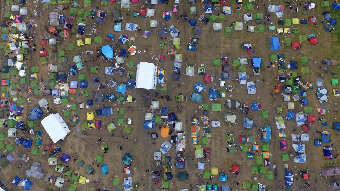 Tents of refugees and migrants stand next to a refugee camp at the Greek-Macedonian border, near the northern Greek village of Idomeni, Monday, March 7, 2016. At a summit in Brussels European Union leaders on Monday sought to press Turkey to do more to stop migrants from entering Europe and to shore up support for Greece, where thousands of people are stranded. (AP Photo/Eldar Emric)