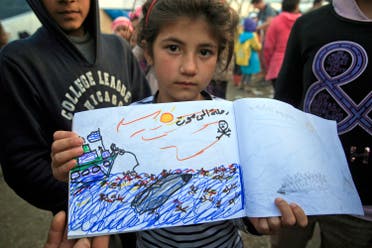 Shaharzad Hassan, 8 year-old from the Syrian city of Aleppo poses with a drawing she made, depicting a migrants rescue operation by the Greek navy, at the northern Greek border station of Idomeni, Friday, March 11, 2016. At an overcrowded refugee camp on the Greek-Macedonian border, 8-year-old Shaharzad Hassan draws pictures of the harrowing events in her life over the past 18 months: Pictures of death in her home town of Aleppo, Syria, and her perilous journey to Europe. The title of this drawing seen top right reads 