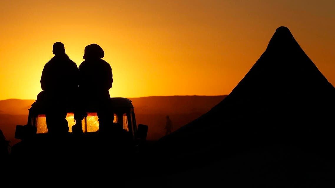 Sahrawi men sit on a car during 35th anniversary celebrations of their independence movement for Western Sahara from Morocco, in Tifariti, southwestern Algeria February 27, 2011. (Reuters)
