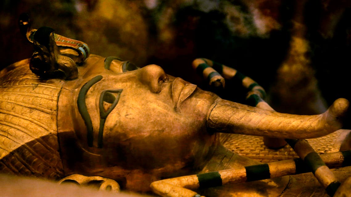 FILE - In this Thursday, Nov. 5, 2015 file photo, one of Egypt's famed King Tutankhamun's golden sarcophagus is displayed at his tomb in a glass case at the Valley of the Kings in Luxor. Egypt's Antiquities Minister Mamdouh el-Damaty, says during a press conference Thursday, March 17, 2016, that analysis of scans of famed King Tut's burial chamber has revealed two hidden rooms that could contain metal or organic material. (AP Photo/Amr Nabil)