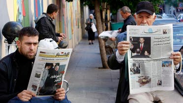 Lebanese men, read newspapers with front pages pictures showing the inauguration ceremony of U.S. President Barack Obama, right, and in the left newspaper front page shows former President Bush and his wife boarding a helicopter and waving with Arabic headline read:"The last emperor," in Beirut, Lebanon, on Wednesday Jan. 21, 2009. (AP)