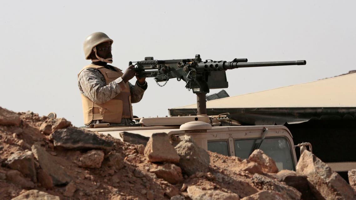 A Saudi soldier sits on top of an armor vehicle as he aims his weapons, on the border with Yemen. (File photo: AP)