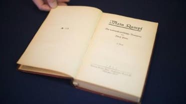 Adolf Hitler's, political manifesto Mein Kampf, discovered at his Munich apartment and signed by eleven American officers, is on display March 18, 2016 before auction at Alexander Historical Auctions in Chesapeake City, Maryland. (AFP)