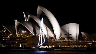 The lights of the Sydney Opera House can be seen before they were switched off for Earth Hour in Sydney, Australia, March 19, 2016 (Reuters)