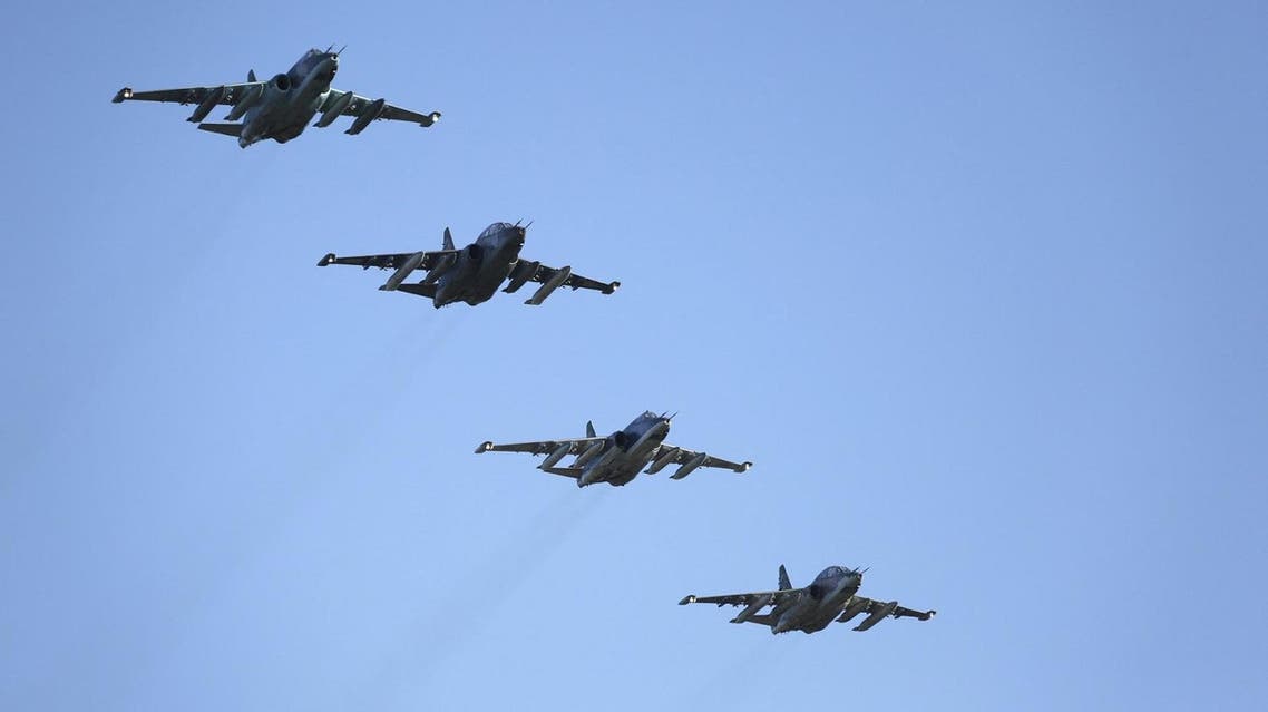 Russian Sukhoi Su-25 fighter jets fly in formation after returning from Syria, before landing at an airbase in Krasnodar region, southern Russia, in this March 16, 2016 handout photo by the Russian Ministry of Defence. REUTERS