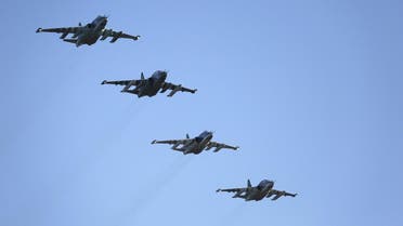 Russian Sukhoi Su-25 fighter jets fly in formation after returning from Syria, before landing at an airbase in Krasnodar region, southern Russia, in this March 16, 2016 handout photo by the Russian Ministry of Defence. REUTERS