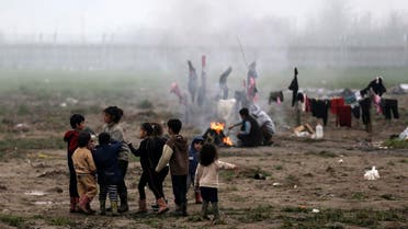 Refugee children play at a makeshift camp for refugees and migrants at the Greek-Macedonian border near the village of Idomeni, Greece, March 18, 2016. REUTERS