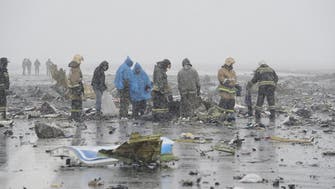 Russian workers comb debris-laden Flydubai crash site