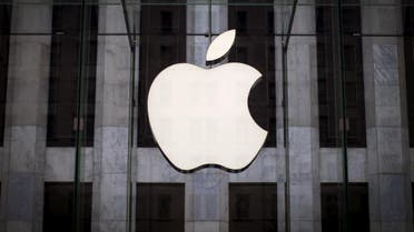 An Apple logo hangs above the entrance to the Apple store on 5th Avenue in the Manhattan borough of New York City. (Reuters)