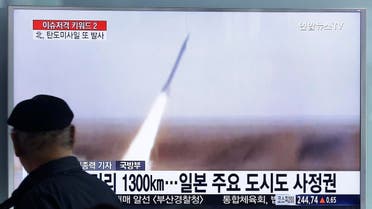 A man watches a TV screen showing a file footage of the missile launch conducted by North Korea, at Seoul Railway Station in Seoul, South Korea, Friday, March 18, 2016. North Korea defied U.N. resolutions by firing a medium-range ballistic missile into the sea on Friday, Seoul and Washington officials said, days after its leader Kim Jong Un ordered weapons tests linked to its pursuit of a long-range nuclear missile capable of reaching the U.S. mainland. The letters on the screen read  The missile puts all of South Korea and part of Japan within striking distance. (AP Photo/Ahn Young-joon)