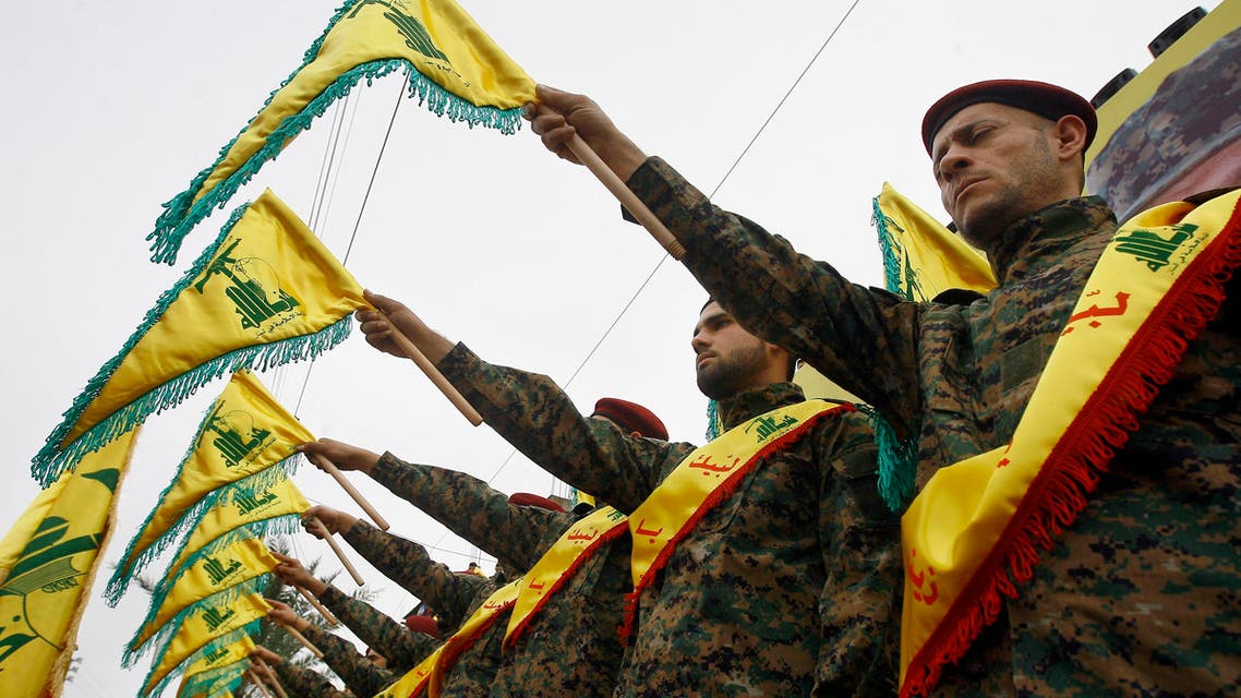 FILE - In this Wednesday, March 2, 2016 photo, Hezbollah fighters hold flags as they attend the funeral procession of Hezbollah senior commander, Ali Fayyad, who was killed last week during an offensive by Syrian troops and Hezbollah fighters in Syria, in the southern Lebanese village of Ansar, Lebanon. Fayyad was a Hezbollah veteran who had led major battles against the Israeli army in south Lebanon. A Saudi-led bloc of six Gulf Arab nations formally branded Hezbollah a terrorist organization on Wednesday, ramping up the pressure on the Lebanese militant group fighting on the side of President Bashar Assad in Syria. (AP Photo/Mohammed Zaatari, File)