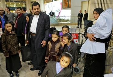 Yemenite Jews Said Ben Yisrael, second left, his wife Simha, right, and their children arrive at Ben Gurion airport near Tel Aviv, Israel, Thursday, Feb. 19, 2009. (AP)