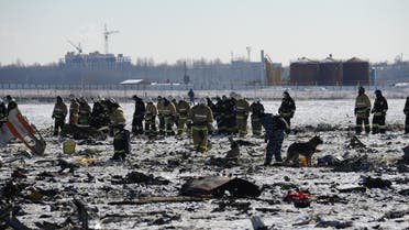 Russian Emergency Ministry employees investigate the wreckage of a crashed plane at the Rostov-on-Don airport, about 950 kilometers (600 miles) south of Moscow, Russia, Sunday, March 20, 2016. Winds were gusting before dawn Saturday over the airport in the southern Russian city of Rostov-on-Don when a plane carrying 62 people from a favorite Russian holiday destination decided to abort its landing. (AP Photo)