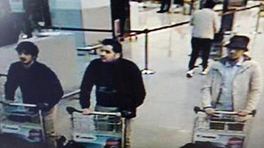 Najim Laachraoui, seen in a white coat and black hat shortly before the attack in photos released, was identified as the third suspect. (Reuters)