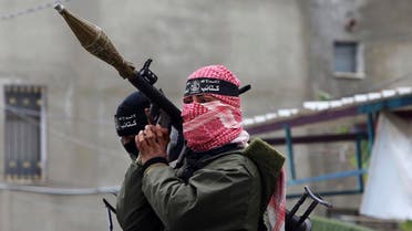 Palestinian militants from the Izzedine al-Qassam Brigades, a military wing of Hamas, attend the funeral of Hamas members killed repairing a tunnel in Gaza City. (File photo: AP)