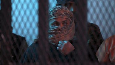 Suspected Al-Qaeda militants stand behind bars during a hearing at the appeals court in the Yemeni capital Sanaa. (AFP)