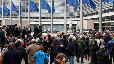 People observe a minute of silence outside the EU Commission Headquarters in Brussels following Tuesday's bomb attacks in Brussels, Belgium, March 23, 2016. (Reuters)