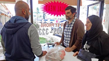 Majd Takriti, center, and his mother, name not given, visiting from Lebanon, pick up Halal meat at a butcher shop in Orange County's "Little Arabia" neighborhood just miles from Disneyland, Wednesday, March 23, 2016. Takriti and other Muslim-Americans reacted Wednesday to comments by GOP presidential candidate Sen. Ted Cruz that called for stricter surveillance of Muslims in the U.S. (AP)