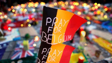 Belgian flags seen at a street memorial service in Brussels following bomb attacks in Brussels, Belgium. (Reuters)