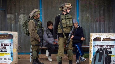 Israeli soldiers stand guard next to the scene of an attack in the West Bank Jewish settlement of Ariel, Thursday, March 17, 2016. (AP)
