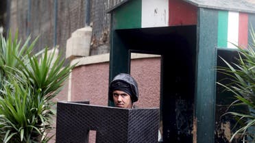 Security personnel stand guard In front of the Italian embassy in Cairo, Egypt, February 6, 2016 file photo. REUTERS