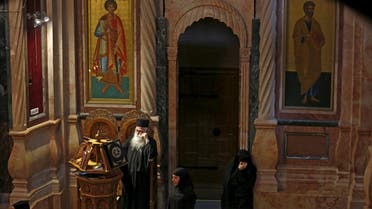 Greek Christian clergy pray on Good Friday, before a procession in the Church of the Holy Sepulchre in Jerusalem's Old City March 25, 2016. reuters
