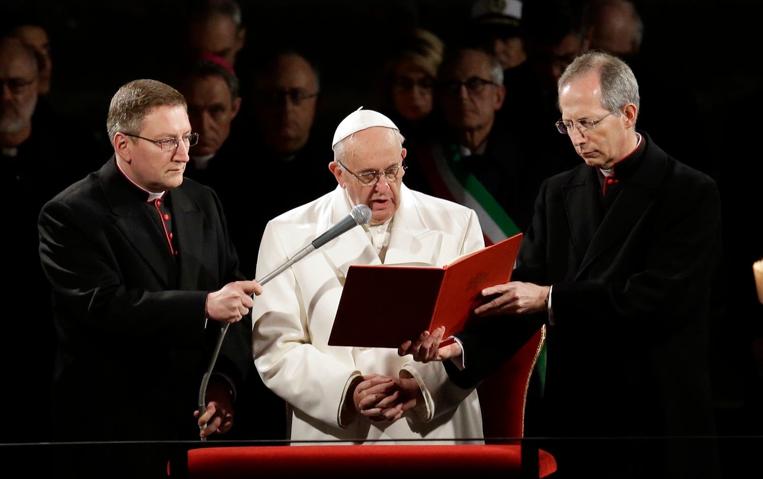 Pope Francis delivers his message during the Via Crucis (Way of the Cross) torchlight procession on Good Friday in front of Rome's Colosseum, Friday, March 25, 2016. (AP)