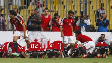 Egypt's players pray as they celebrate after Ahmed Hassan "Koka" scored a goal during their 2018 World Cup qualifying soccer match against Chad at Borg El Arab "Army Stadium" in the Mediterranean city of Alexandria, north of Cairo, Egypt, November 17, 2015. (Reuters)
