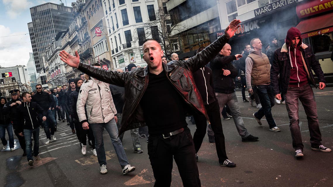 Right wing demonstrators protest at a memorial site at the Place de la Bourse in Brussels, Sunday, March 27, 2016. (Reuters)