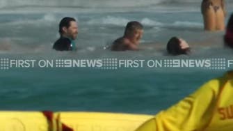 Hugh Jackman helps swimmers to safety from dangerous surf